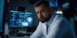 © gunzexx png and bg - A man in a sophisticated office environment concentrating intently on multiple computer screens displaying complex data, representing focus and technology.