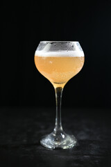 glass of beer on a dark table table on a dark background