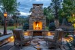 © Roey - Colorado Springtime Evening Patio with Stone Outdoor Fireplace and Cozy Seating