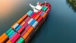 © Nitchalee N. - Aerial view of a cargo ship loaded with colorful containers navigating through calm waters.