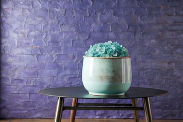 Wall Mural - Decorative jar with blue crystals on a wooden stand.