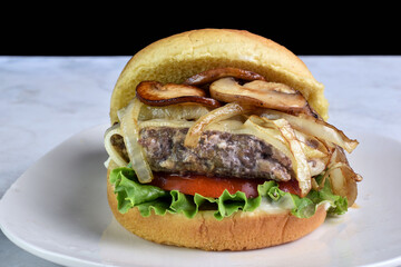 hamburger  top with  onions and  mushrooms