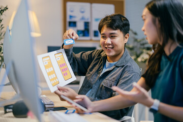Poster - Asian ui/ux designers discussing mobile app design in modern office, brainstorming, planning, and collaborating as a team
