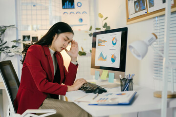 Aufkleber - young businesswoman is having a headache and feeling tired from working on a computer all day. she i