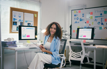 Poster - young professional is working in a bright office, surrounded by charts and data, demonstrating the m