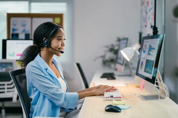 Poster - confident young businesswoman works at her desk in a modern office, providing online customer suppor