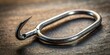 © Latsamee - A close up stock photo of a fishing hook made of forged steel with a re sharpened pointed and sharp silhouette, hook,fishing, silhouette, re-sharpening, sharp