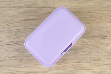 Poster - Plastic lunch box on wooden table, top view