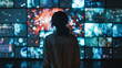 © Людмила Мазур - Woman stands in front of a large screen with many images on it. The woman is looking at the screen with interest. The images on the screen are colorful and dynamic, creating a sense of excitement