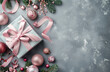 © PixelCharm - Elegant Christmas Gift With Pink Ribbon and Festive Decorations, copy space
