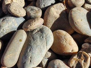 River, sea pebbles, small fraction. Stones for path. Gravel. Pebbles in landscape design. Round stones close up