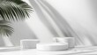 © Elkhan Babayev - Textured white podiums against a clean backdrop, featuring the natural shadow of a palm leaf, perfect for highlighting products with a tropical vibe.