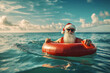© Ирина Щукина - A man in a Santa hat is riding a red inflatable raft in the ocean