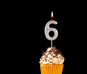 Canvas Print - Birthday cupcake on black background - Number 6 shaped candles.