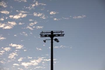 stadium lights against blue sky