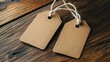 © HA - Two Blank Brown Paper Tags on Wooden Surface