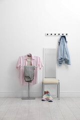 Poster - Coat rack, stool, mirror, clothes and shoes in hallway