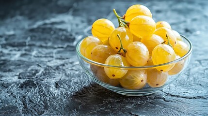 Poster - Fresh gooseberries in glass bowl on black stone slate background Copy space : Generative AI