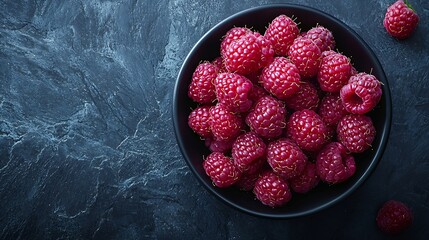 Poster - Fresh raspberries on a black bowl Stone background Top view : Generative AI