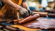 © jureephorn - Leather finishing in the tanning industry, with workers applying dyes, polishing, and finishing leather to achieve the desired texture, color, and quality for premium products