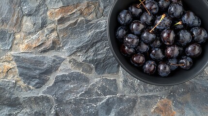 Poster - Fresh ripe black cherries in a black bowl on a stone background Top view : Generative AI