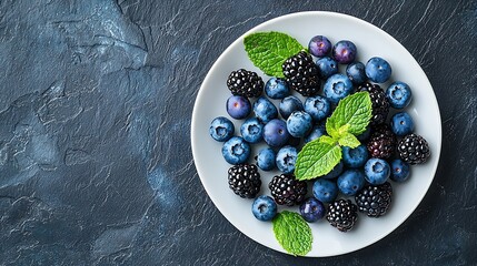 Poster - Fresh blueberry and blackberry berries with mint leaves on a white plate on blue stone background Top view Copy space : Generative AI