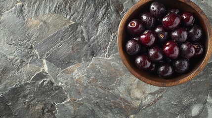 Poster - Fresh ripe black cherries in vintage backing dish on a stone background Copy space Top view : Generative AI