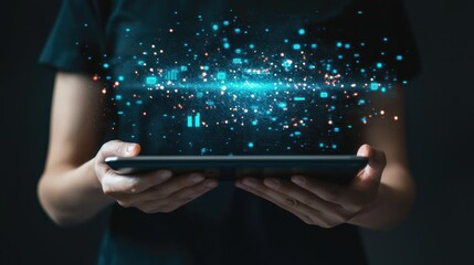 a person using a tablet with futuristic digital analytics floating above.