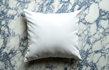 A single white pillow on a marble background, perfect for displaying your design or logo.