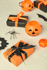 Wall Mural - Gift boxes with Halloween decorations on textured green background