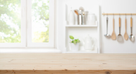 Wall Mural - wooden table for product montage with bright blur interior of kitchen