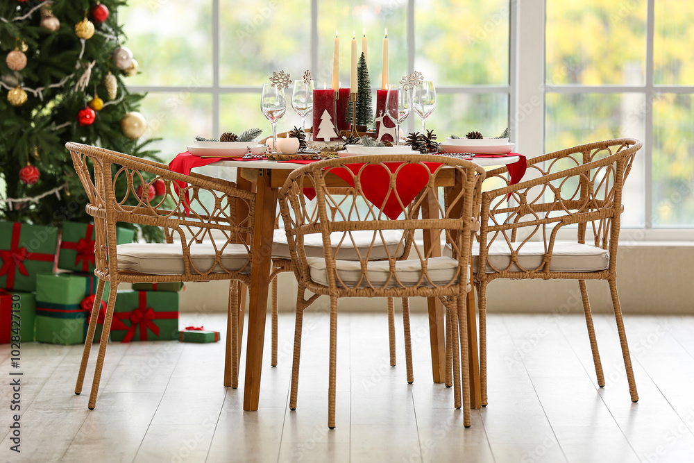 Festive dining table with Christmas setting in room