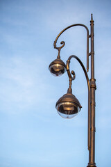 A street light with two lights hanging from it