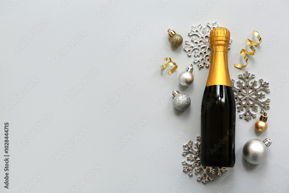 Champagne bottle with Christmas decor on white background