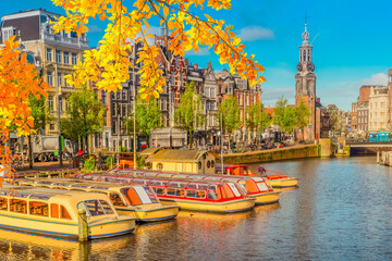 Wall Mural - moored boats and facades of old historic houses over canal water, amsterdam, netherlands