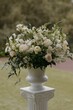 © Wirestock - Elegant floral arrangement in classic white vase