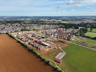 Poster - Aerial view of a residential neighborhood and construction site