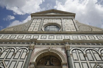 A detailed view of the facade of the Basilica of Santa Maria Novella in Florence.