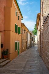 Naklejka na meble Charming Mediterranean village street with colorful buildings.