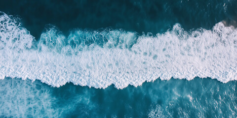 Waves on the sea ocean and turquoise blue waters as a background. Aerial top view from air. Summer vacation concept.