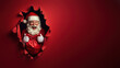© Oksana - Santa with glasses joyfully breaking through paper