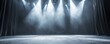 © Pixel Chaser  - Grey Empty Stage Illuminated with Spotlights and a Curtain