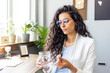 © Dragana Gordic - Confident Professional Woman Taking a Break in Modern Office