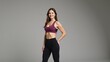© Pixel Matrix - Woman empowered by body positivity and fitness poses confidently in workout setting