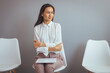 © Dragana Gordic - Woman Waiting Anxiously for Job Interview in Office Setting