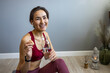 © Dragana Gordic - Smiling Woman Relaxing With Water and Snack After Yoga