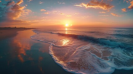 Poster - A serene coastal beach during sunset. The sun is low on the horizon.