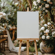 © visoot - A blank white welcome sign mockup, size is 24 by 36 inches in portrait orientation, on an easel during a wedding party.