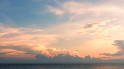 Wall Mural - sunset, sky blue and cloud over sea in the evening with orange, yellow,summer sea beach with golden 