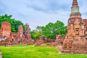 Wat Mahathat complex with brick ruins of shrines and chedis, Ayutthaya, Thailand